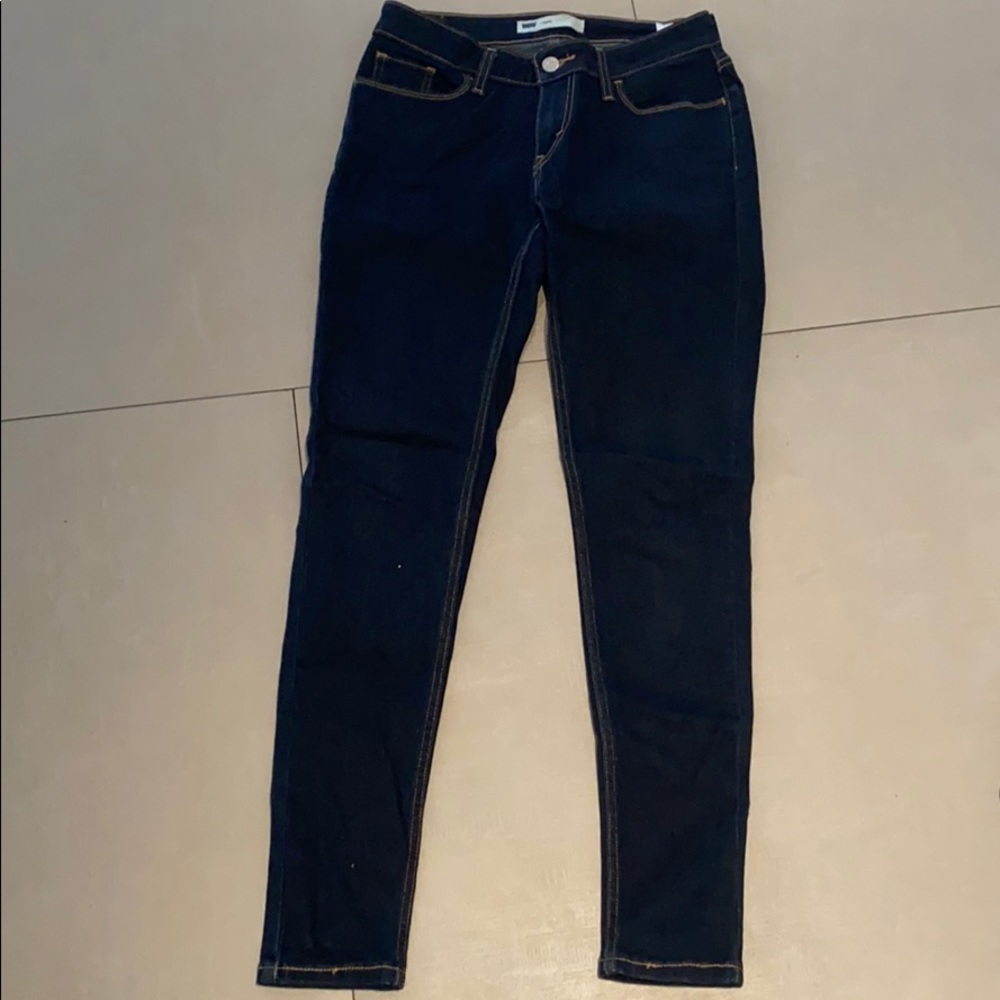 Levi’s dark blue skinny/legging style jeans.